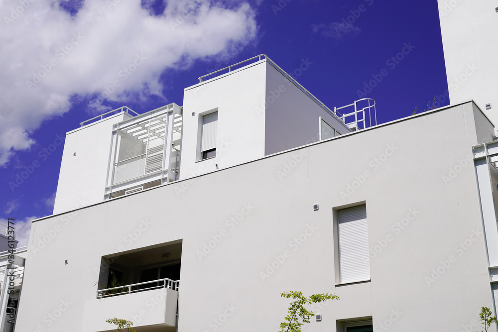 Modern white Luxury Apartment Building and blue sky