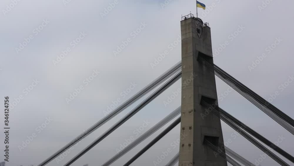 Aerial drone view View Of North or Moscow Bridge Kiev, Ukraine over Dnieper. City view. Traffic on the bridge. Fog. Rotation around the bridge Aerial drone view View Of North or Moscow Bridge Kiev, Ukraine over Dnieper. City view. Traffic on the bridge. Fog. Rotation around the bridge