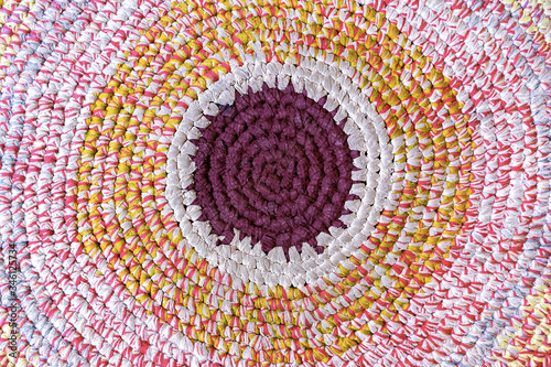 Fototapeta Naklejka Na Ścianę i Meble -  Multicolor knitted round carpet or rug