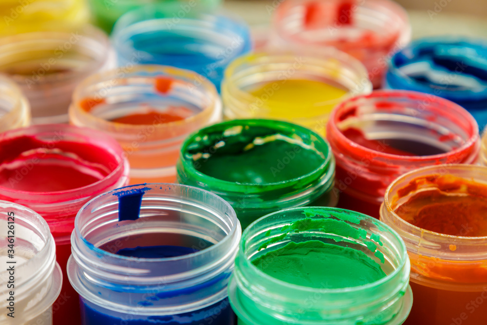 open jars with colored gouache open jars with colored gouache