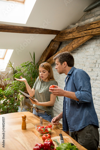 Loving young couple cutting...