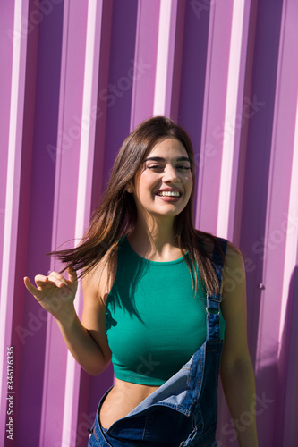 Trendy young woman standing...