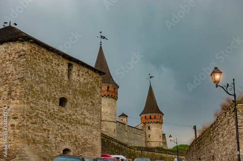 Part of the famous ancient fortress in Kamenetz-Podolsk. View from the fortress to the city of Kamenetz-Podolsk photo