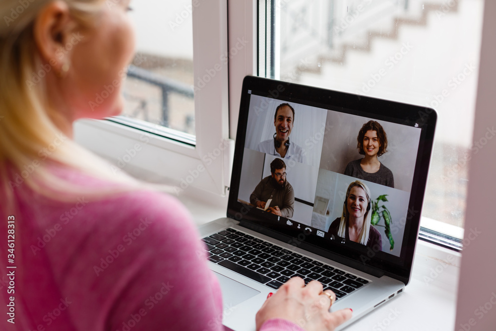 Woman Working From Home Having Group Videoconference On Laptop Woman Working From Home Having Group Videoconference On Laptop
