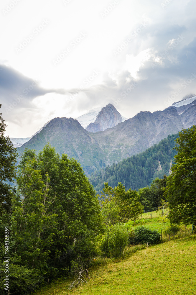 Obraz premium French Alps mountains in a cloudy summer day, seen from Les Houches near Chamonix, Haute Savoy, France.