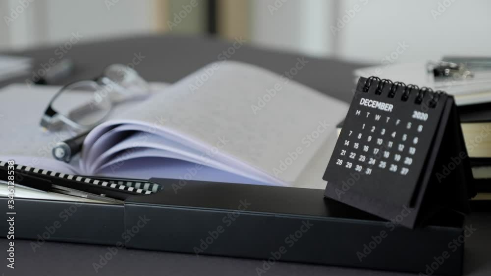 Small black calendar standing on the office desk. December month 2020 Year. Small black calendar standing on the office desk. December month 2020 Year.