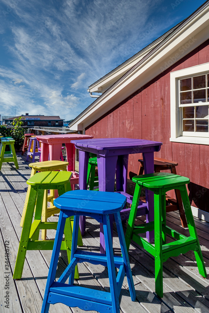 Colorful Wood Stools and Tables on a Restaurant Patio