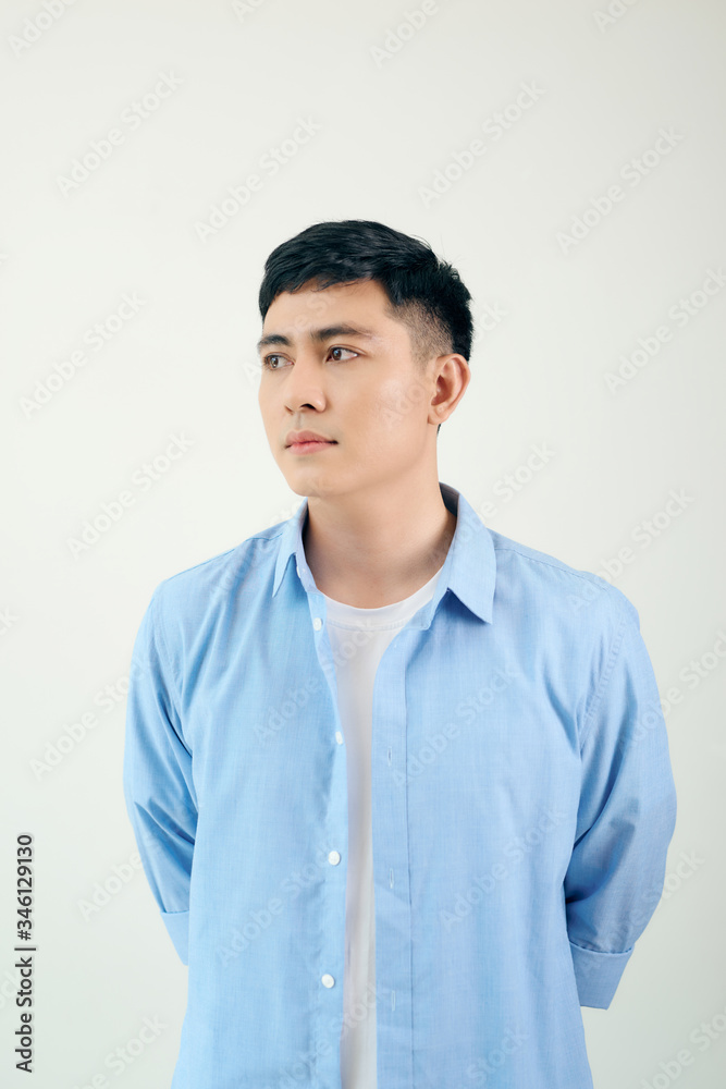 Stylish Asian guy leaning and looking at the side Stylish Asian guy leaning and looking at the side