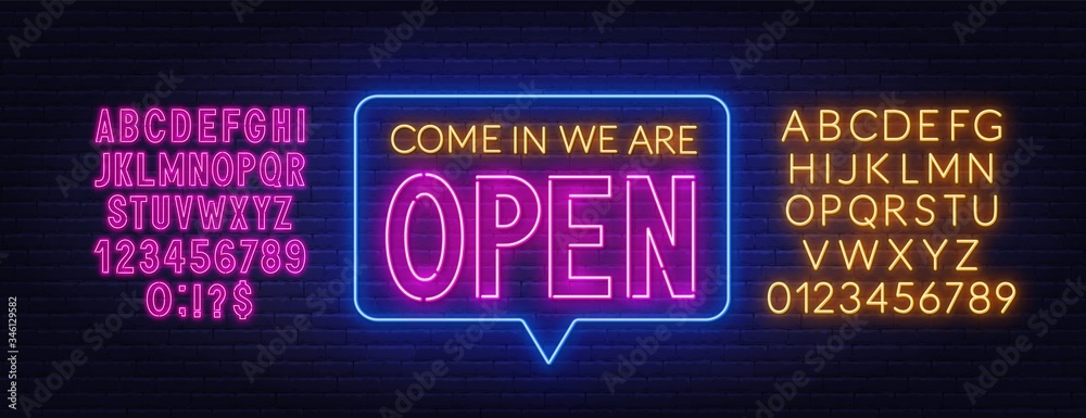 Fototapeta premium Come in we are open neon sign. Neon alphabet on brick wall background. Vector illustration.