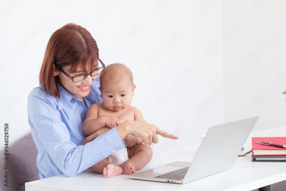 Beautiful Asian mother multitask nurture newborn at home office, employee work from home feeding, playing, holding, smiling with toddler, mother take care baby and working with laptop technology Beautiful Asian mother multitask nurture newborn at home office, employee work from home feeding, playing, holding, smiling with toddler, mother take care baby and working with laptop technology