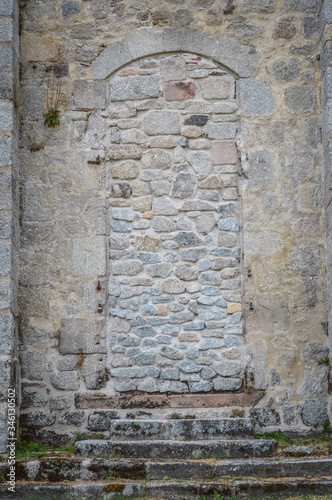 Ancient blocked door at the fortified monastery of Saint-Michel des Anges at Saint-Angel  France.