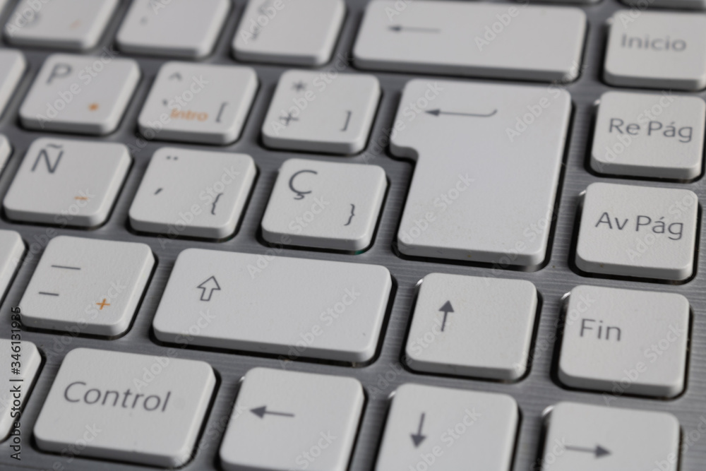 grey laptop with white keyboard grey laptop with white keyboard