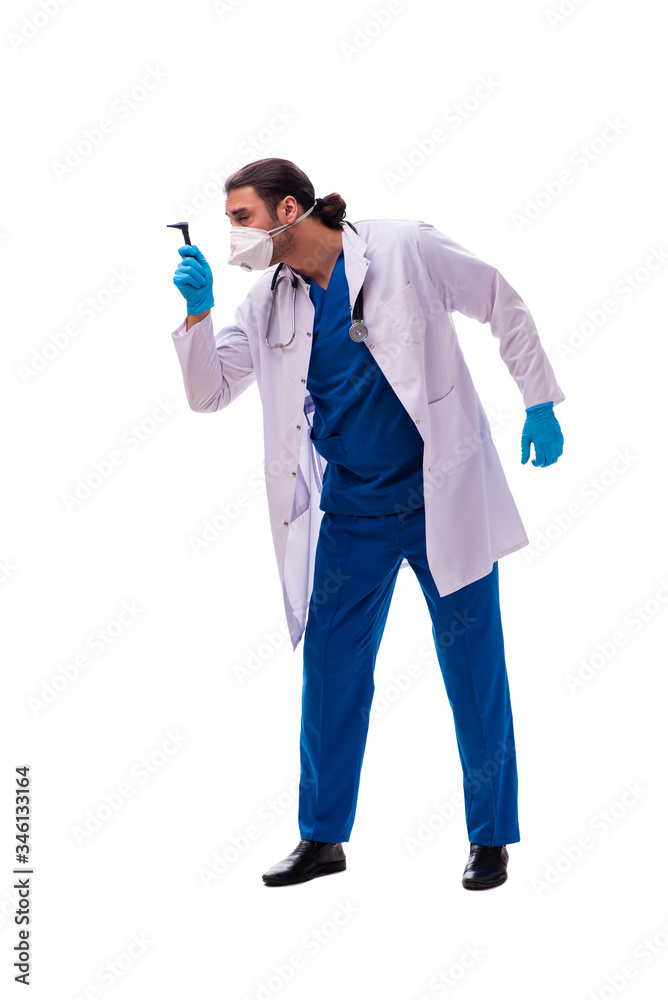 Young male medic in coronavirus concept isolated on white Young male medic in coronavirus concept isolated on white