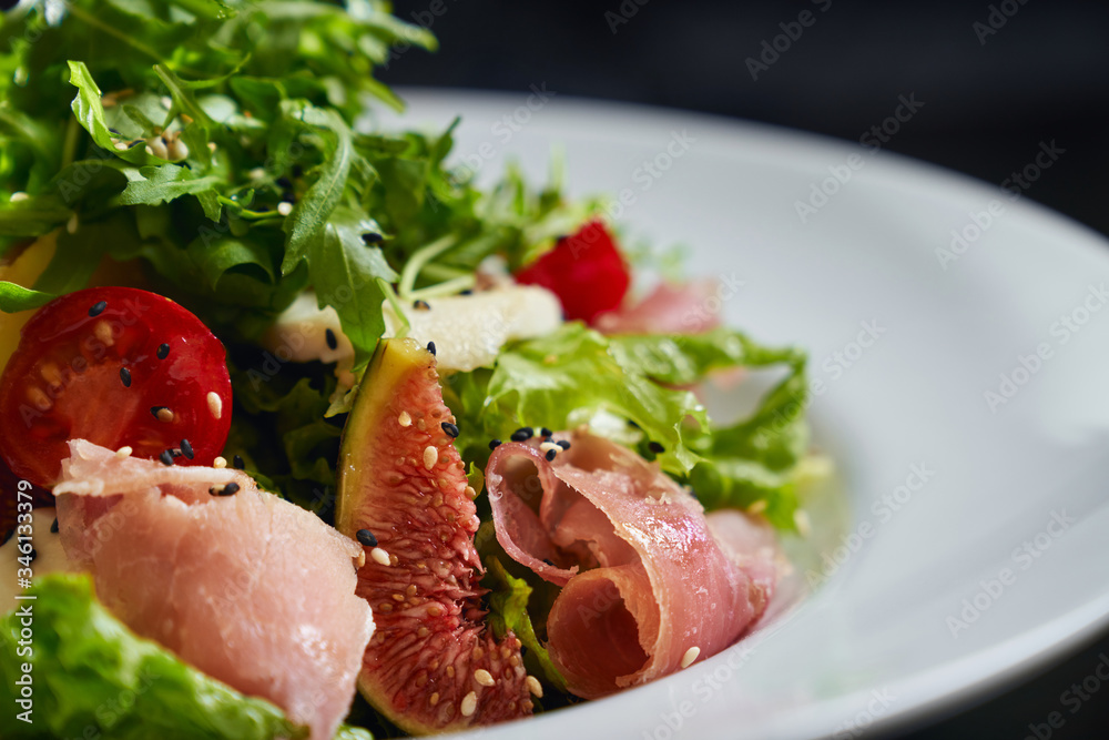 Salad with ham, figs and vegetables. Salad with ham, figs and vegetables.