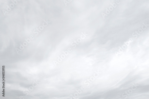 Abstract nature background of shiny white & gray puffy fluffy clouds or soft cloudscape in tropical summer or spring morning sunlight & sun rays at daylight sunshine day, purity or heaven concept