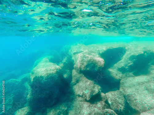 Fototapeta Naklejka Na Ścianę i Meble -  Underwater view of Alghero rocky shore in summer