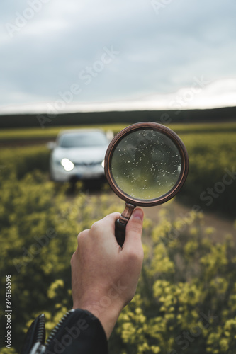 girl holding magnifying glass