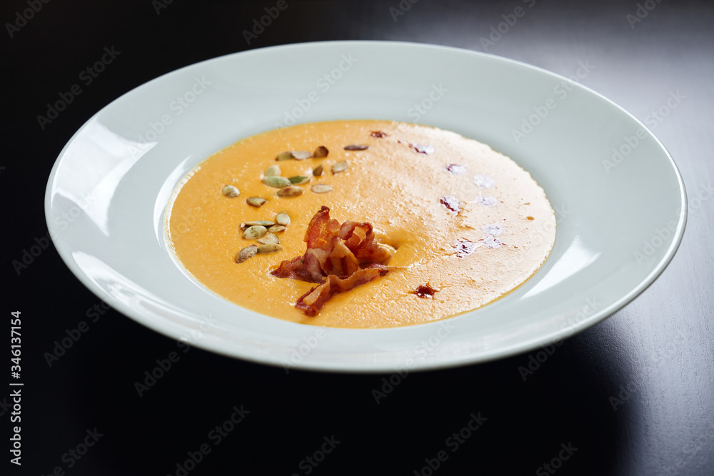 Cream soup with bacon and pumpkin seeds. Cream soup with bacon and pumpkin seeds.
