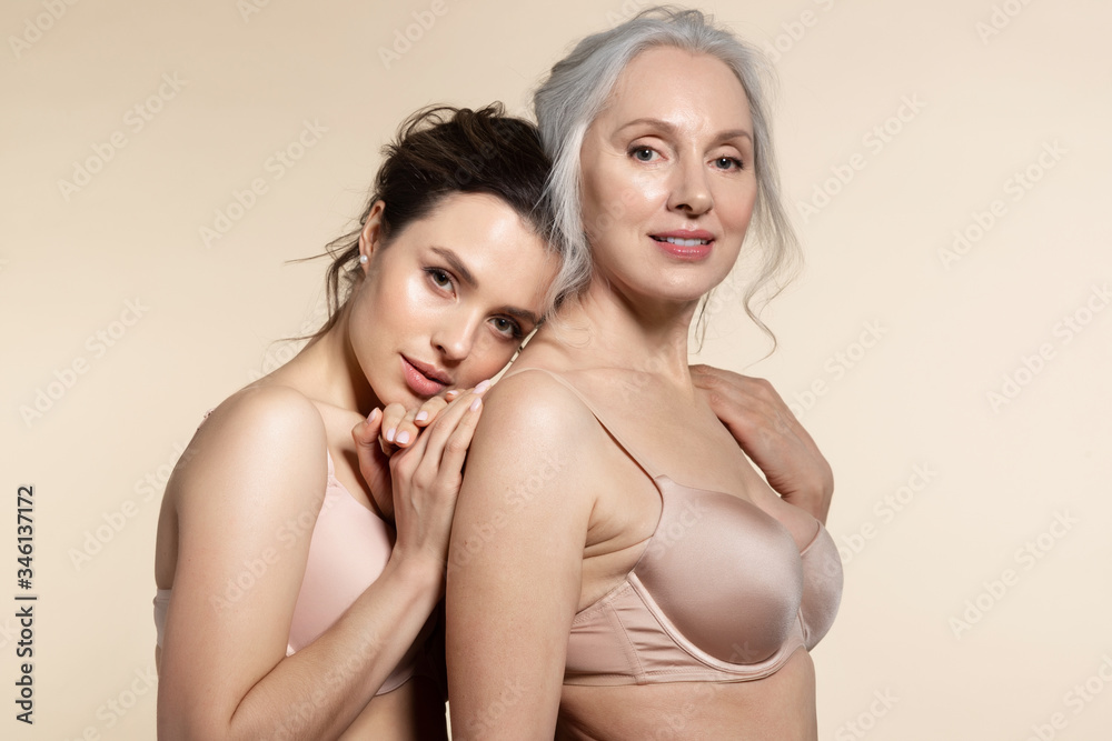 Fototapeta premium Young woman leaned head on senior back. 