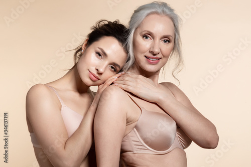  Two charming adorable dreamy beautiful woman elderly and young. 