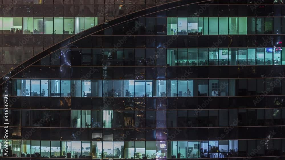 Aerial view of lights from windows of offices. Skyscraper with working people in the evening in Business Bay, Dubai, United Arab Emirates Timelapse Aerial view of lights from windows of offices. Skyscraper with working people in the evening in Business Bay, Dubai, United Arab Emirates Timelapse