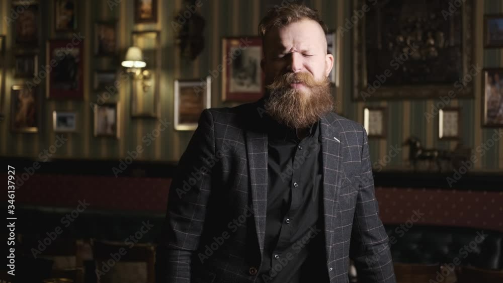 drunk man in suit with beard and mustache talking and smiling laughing, caucasian, having fun and talking in bar,concept alcohol relaxing in a bar and restaurant drunk man in suit with beard and mustache talking and smiling laughing, caucasian, having fun and talking in bar,concept alcohol relaxing in a bar and restaurant