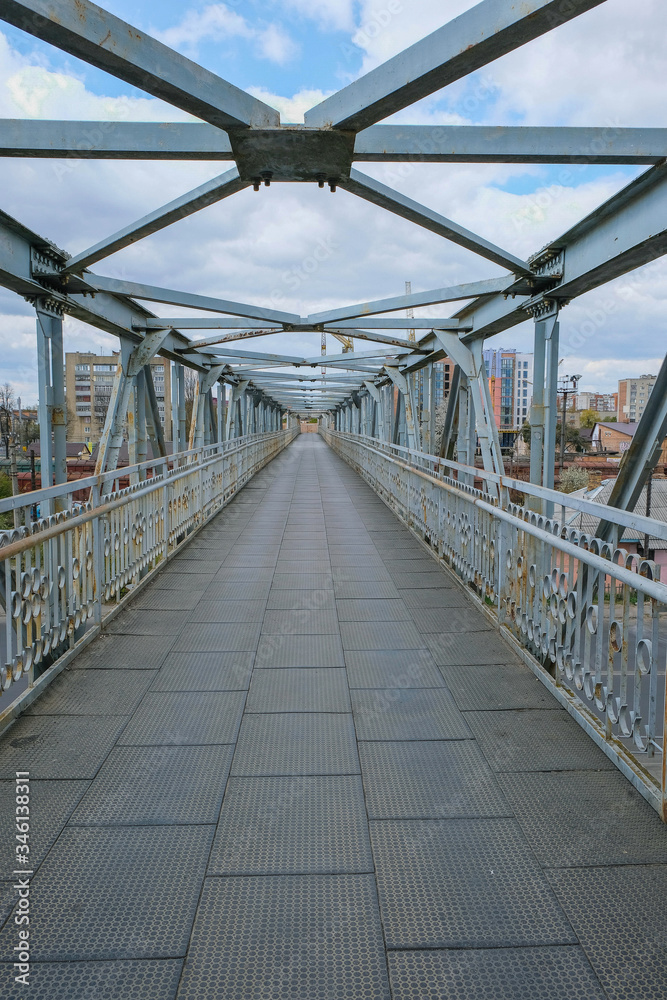 Fototapeta premium Metal truss bridge isolated. Vertical image. Copy space.