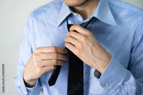 Sweating business man due to hot climate after work outdoor
