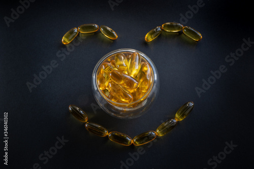 Fish oil capsules in fish shape photo