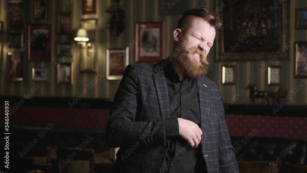 drunk man in suit with beard and mustache talking and smiling laughing, caucasian, having fun and talking in bar,concept alcohol relaxing in a bar and restaurant drunk man in suit with beard and mustache talking and smiling laughing, caucasian, having fun and talking in bar,concept alcohol relaxing in a bar and restaurant