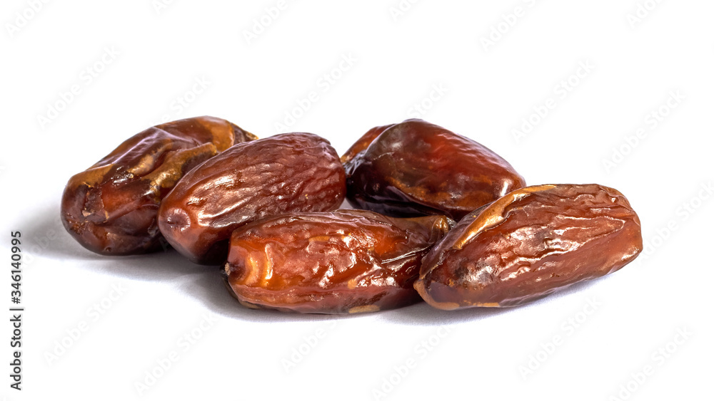 Dry dates on a white isolated background