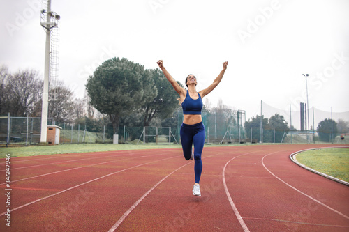 Athlete running on the run track outdoor © merla