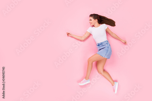 Top above high angle view full length photo of nice cute sweet girlish lady sporty girl lay run copyspace enjoy moving wear good look clothes footwear isolated over pastel color background