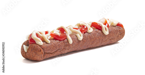 One frikadel with ketchup, mayonnaise on chopped onions, a Dutch fast food snack called 'frikadel speciaal'