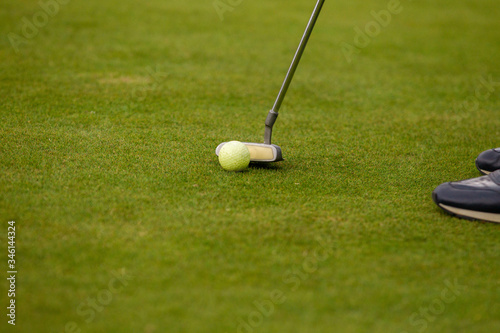 Player a during a golf game during a hit
