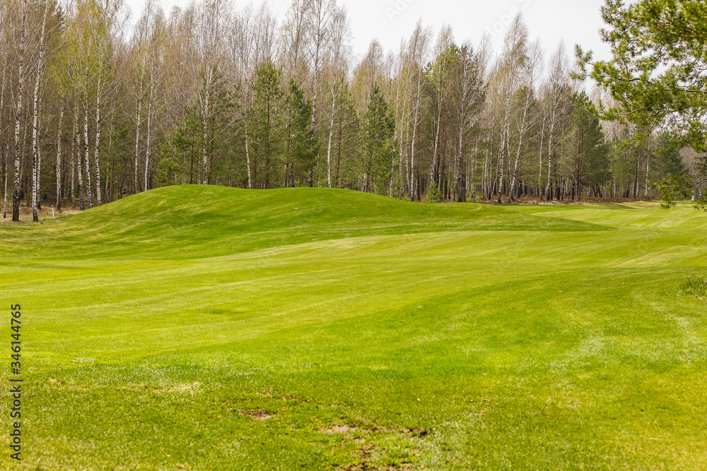 Playing golf on the green and during training