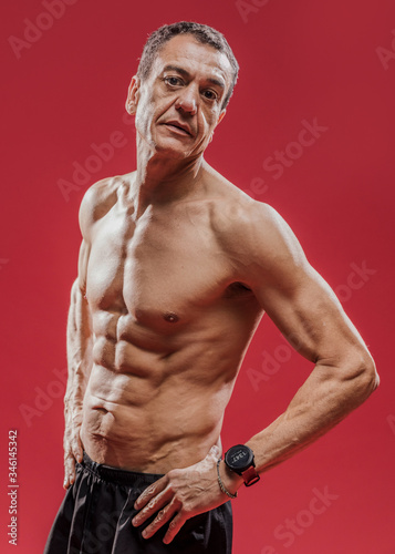 High angle mature athlete man with abdominal muscles