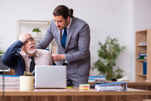 Two employees in pandemic concept at workplace