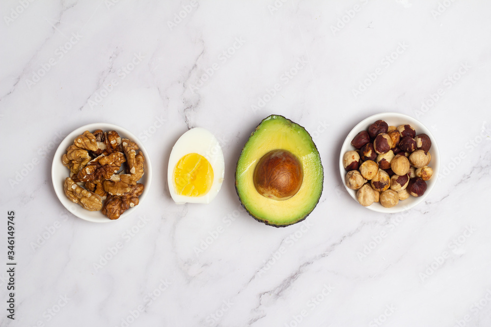 nuts, avocado and eggs on a white background
