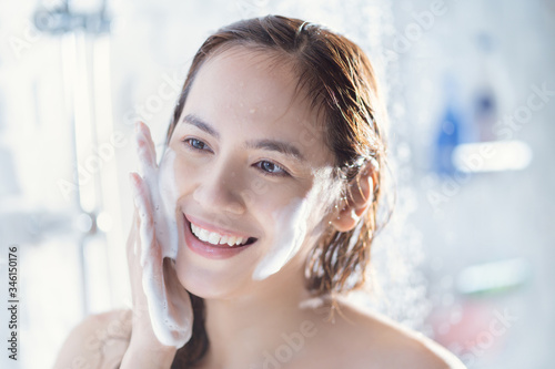 Asian woman use foam to wash your face after showering. Free Download Asian woman use foam to wash your face after showering. - GFXLoad