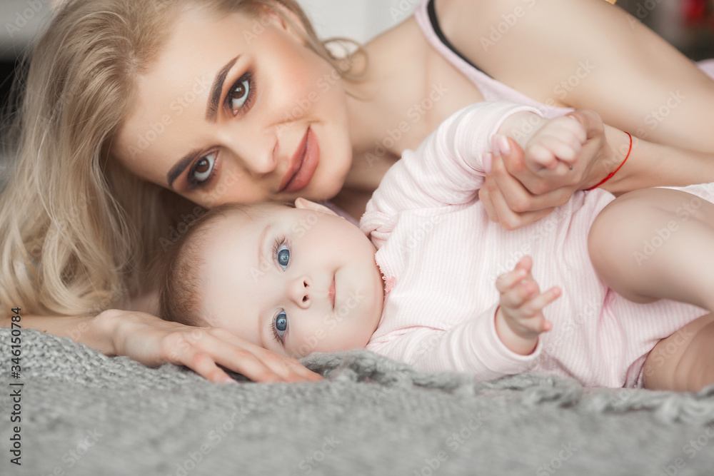 Young mother with little baby. Mommy holding her cute child. Maternity concept. Young mother with little baby. Mommy holding her cute child. Maternity concept.