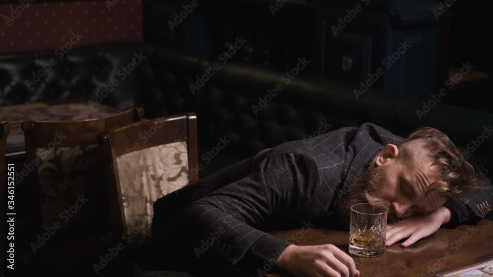 drunk man fell asleep at table with glass of whiskey, Bourbon, Rum