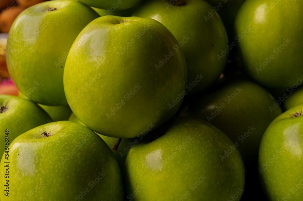 Green apple, a variety of apple created as a hybrid between the French Crab apple and the Rome beauty, displayed for sale at New Market area, Kolkata, India. Green apple, a variety of apple created as a hybrid between the French Crab apple and the Rome beauty, displayed for sale at New Market area, Kolkata, India.