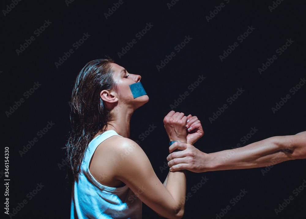 Kidnapping use hand covering girl mouth, close up woman's face feeling