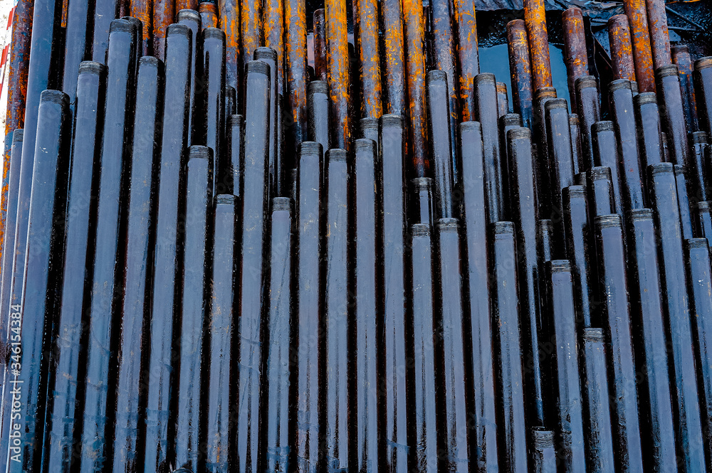 Construction of Oil and Gas Pipeline, horizontal directional drilling. Drilling of oil and gas wells. In the foreground, a threaded joint of pipes Construction of Oil and Gas Pipeline, horizontal directional drilling. Drilling of oil and gas wells. In the foreground, a threaded joint of pipes