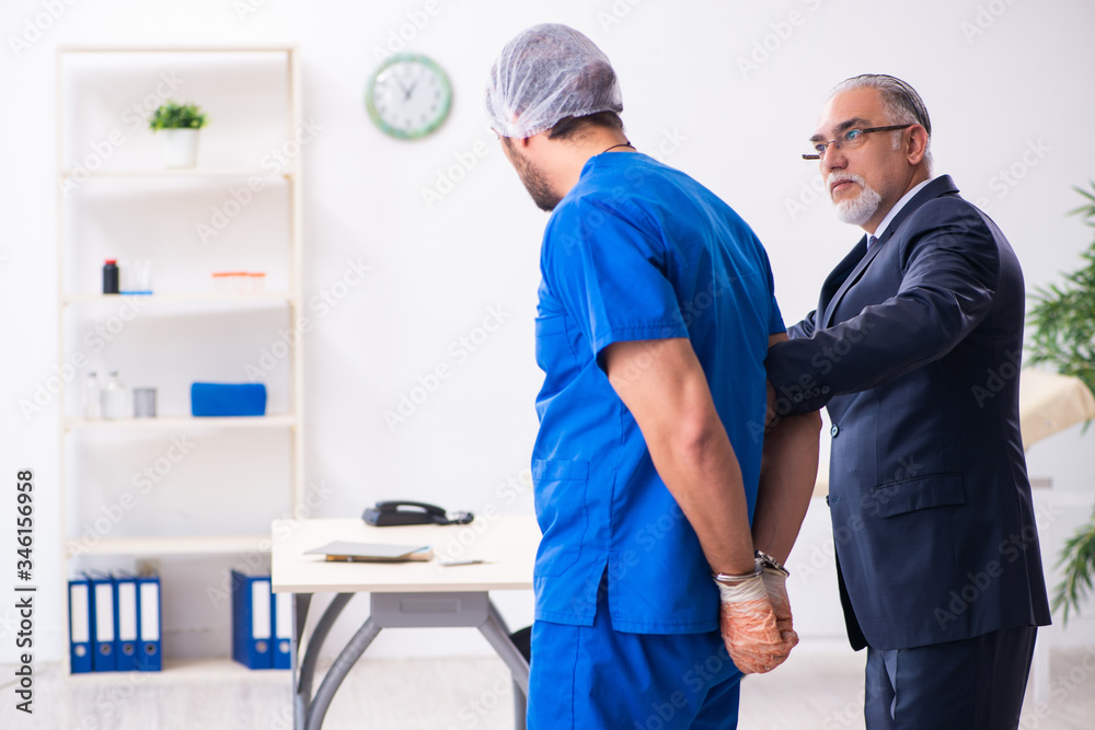 Male doctor in courthouse meeting with advocate Male doctor in courthouse meeting with advocate