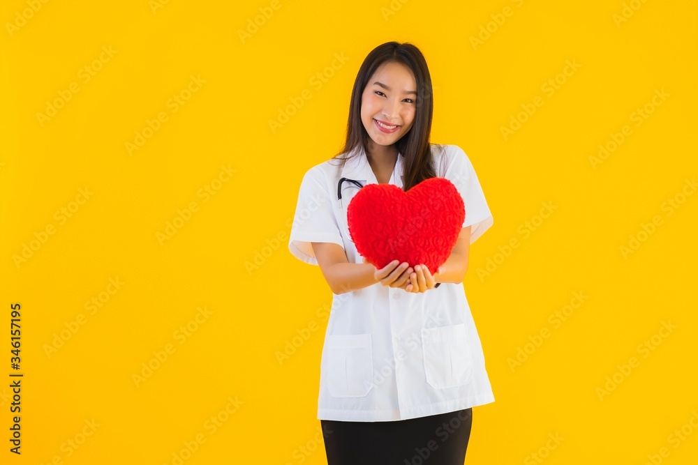Portrait beautiful young asian doctor woman show heart for symbol of love Portrait beautiful young asian doctor woman show heart for symbol of love
