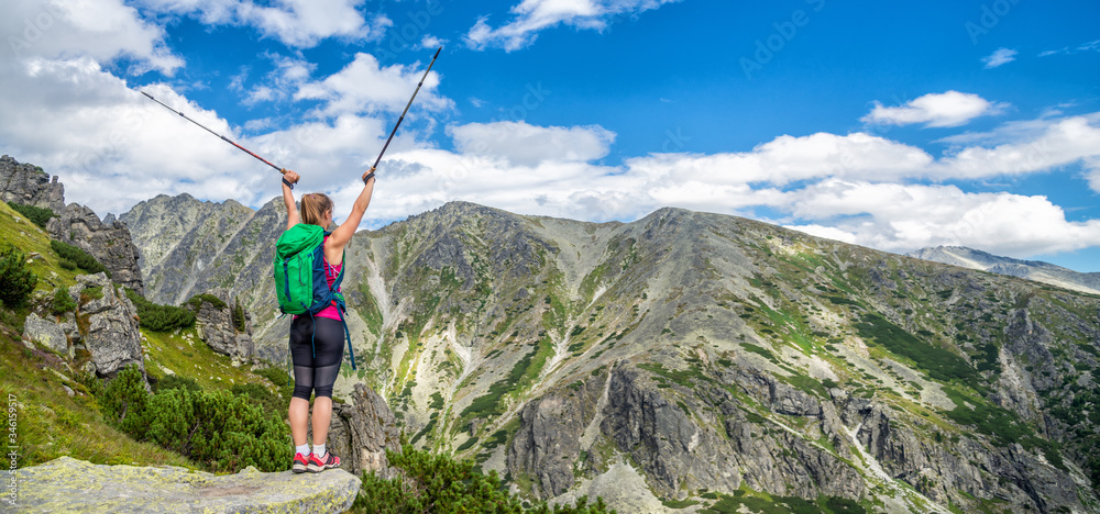 Young woman hiking in the mountains