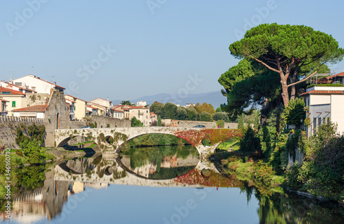 Old bridge over Bisenzio river landscape view in Prato Tuscany Italy in a sunny day  photo