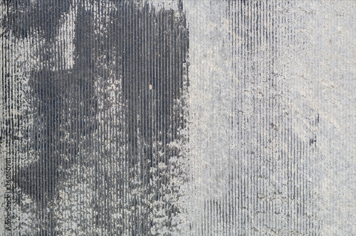 Panel of gray slate with traces of black paint, texture